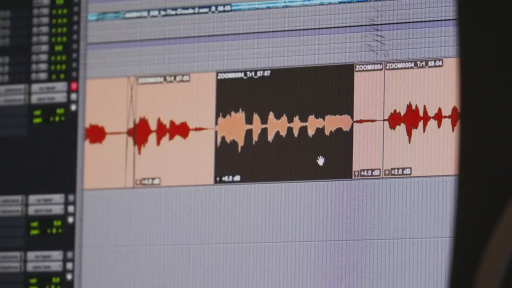 Audio waveforms being edited and gain-matched in Pro Tools